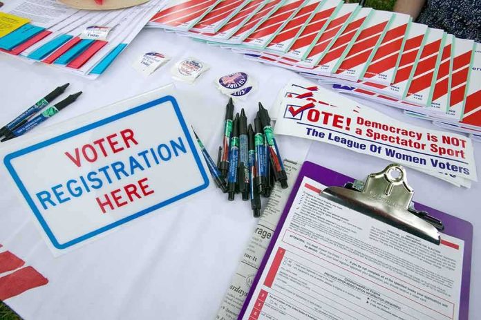 shutterstock_177445370-1 Voter registration table with forms, pens, and informational materials