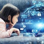Child lying on couch using a laptop with digital icons overlay
