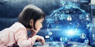 Child lying on couch using a laptop with digital icons overlay