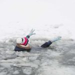 15 Year Old Survived Days on an Overturned Boat person fallen through ice raising gloved hands