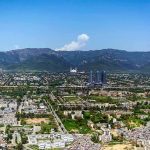 Saudi Arabia’s Enemies Are CLOSING IN Cityscape with mountains in the background