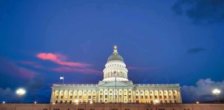 Utah State Capitol building at dusk with illuminated dome