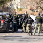 Cop’s Wife VANISHES After He’s Found Dead Police and sheriff officers gather around vehicles on a suburban street