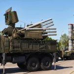Putin HAMMERS Ukraine With Missiles and Drones military air defense vehicles on a road