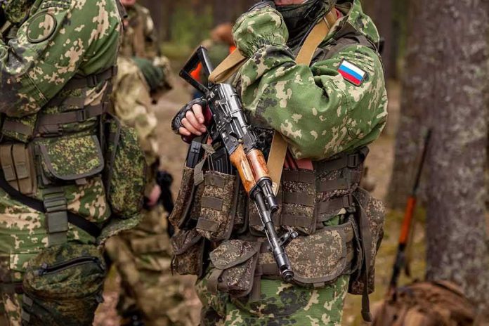 shutterstock_2204983673 soldier in camouflage holding a rifle