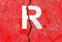 Letter R on cracked red wall