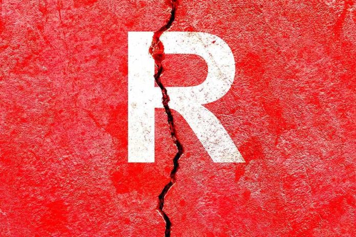 Letter R on cracked red wall
