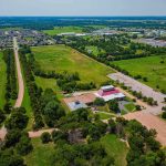 How One State Wants to Kill Its Income Tax Using Tech Giants Aerial view of rural landscape with roads, fields, and scattered buildings