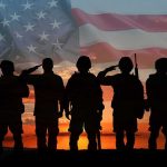 76 Combat Medals Awarded But Key Details Are MISSING Soldiers saluting at sunset with American flag overlay