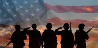 76 Combat Medals Awarded But Key Details Are MISSING Soldiers saluting at sunset with American flag overlay