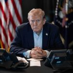 Trump Tells United Nations ‘Freedom Is Coming to Cuba’ Donald Trump seated at a table between two desk phones