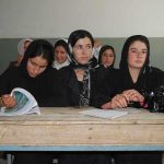 Sihem Habchi and other women seated at a classroom desk