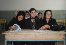 Sihem Habchi and other women seated at a classroom desk