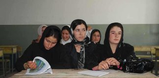 Sihem Habchi and other women seated at a classroom desk