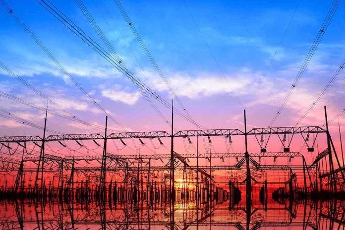 Electrical substation with power lines at sunset