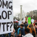 Rural Texas Revolts Against Massive AI Data Center Boom Protesters holding signs at a city street demonstration