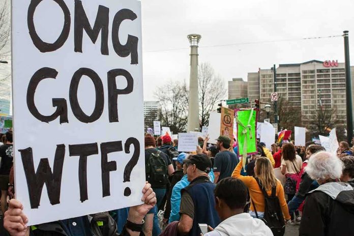 Protesters holding signs at a city street demonstration