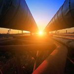 Pipeline Attack Threatens MILLIONS of Barrels of Oil Industrial pipelines at sunset