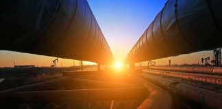 Industrial pipelines at sunset