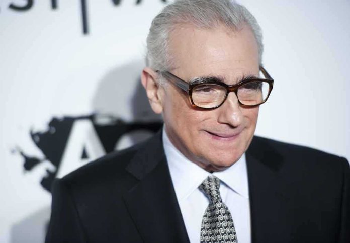 Martin Scorsese wearing glasses and a dark suit at an event