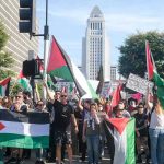 Hamas CELEBRATES October 7 Anniversary Protesters holding Palestinian flags gather in a city street