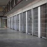Trump Vows MANDATORY Prison Time For This Crime prison cell block with metal barred doors
