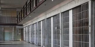 Trump Vows MANDATORY Prison Time For This Crime prison cell block with metal barred doors