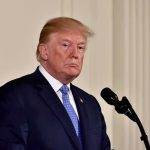 Trump’s Raw Reaction to Mike Ditka’s DEATH man in suit at a podium