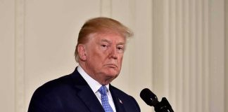 Trump’s Raw Reaction to Mike Ditka’s DEATH man in suit at a podium