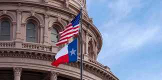 Vanished Democrat Finally BREAKS His Silence Texas and U.S. flags in front of a capitol building dome