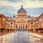 Catholic Founder’s DARK Secret Finally Confirmed St. Peter's Basilica at the end of a wet street at dusk