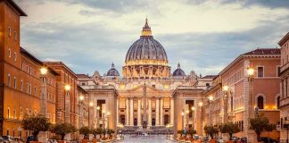 Catholic Founder’s DARK Secret Finally Confirmed St. Peter's Basilica at the end of a wet street at dusk