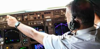 Passengers Fight for Their Lives Midair Pilot adjusting controls in an airplane cockpit