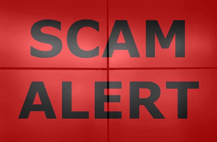 shutterstock_1421897513 Scam alert text on red background