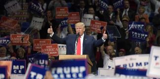 Trump Launches a 17 State Midterm Offensive Donald Trump speaks at a rally, giving two thumbs up
