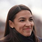 AOC’s Strange Reason for Backing TRANS Athletes woman smiling in an outdoor close-up portrait