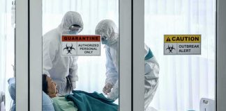 Russian PLAGUE Lab Worker Dies Healthcare workers in hazmat suits treat a patient in a quarantine room