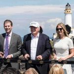 Donald Trump, Ivanka Trump, Eric Trump, and Donald Trump Jr. at outdoor ribbon cutting by lighthouse