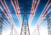 High-voltage transmission towers with glowing power lines