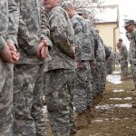 Livestream of Firing Squad Execution Canceled by Trump Soldiers in camouflage uniforms stand in two facing rows outdoors