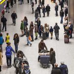 Airports Will SCAN Faces Instead of Passports Crowd of travelers in an airport arrivals hall