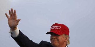 Trump Backs Firing Squad for Fort Hood TERRORIST Donald Trump waving in a red cap