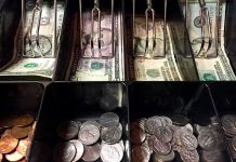 Cash register drawer with US bills and coins