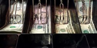 Store Owner Lost $460K to FEDS Cash register drawer with US bills and coins