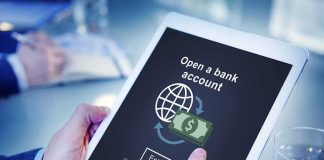 Your Child May Already Have a TRUMP Account Person using tablet with online bank account signup screen