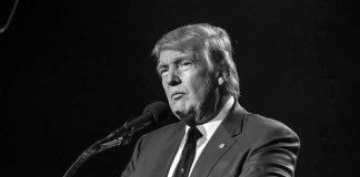 NAKED Trump Statue Put on Display Donald Trump speaking at a microphone in a black-and-white photo
